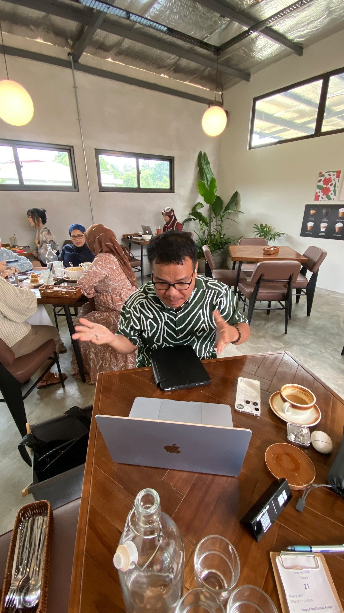 Consultation session with Cikgu at a cafe table